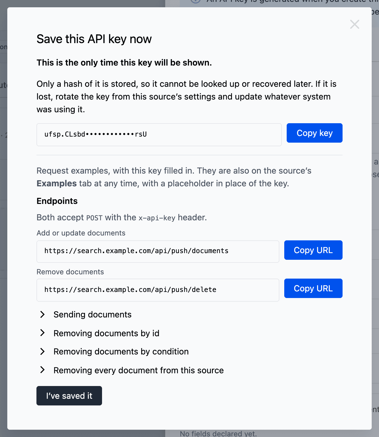 The Save this API key now dialog after Create push source. The dialog shows the push API key partly masked with a Copy key button, the Add or update documents and Remove documents endpoint URLs, and the I have saved it button.