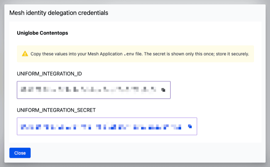 The credentials dialog showing the integration ID and app secret, displayed only once on generation.